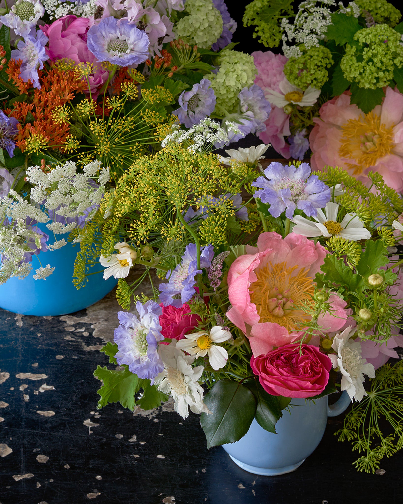 Detail of Limited Edition "Dolly" Fine Art Photographic Print, Colourful Bunches of Flowers Arranged in Jugs on a Vintage Table Against a Black Background